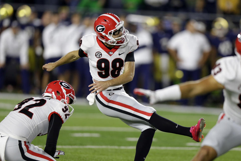 Georgia’s Rodrigo Blankenship (98) kicks a field goal from the hold of Cameron Nizialek during the second half of an NCAA college football game against Notre Dame in South Bend, Ind., Saturday, Sept. 9, 2017. Georgia won 20-19. (AP Photo/Michael Conroy)