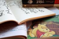 Illustration picture of "Winnie the Pooh", a book of poems by Chinese late chairman Mao Zedong, "Animal Farm" and "1984\