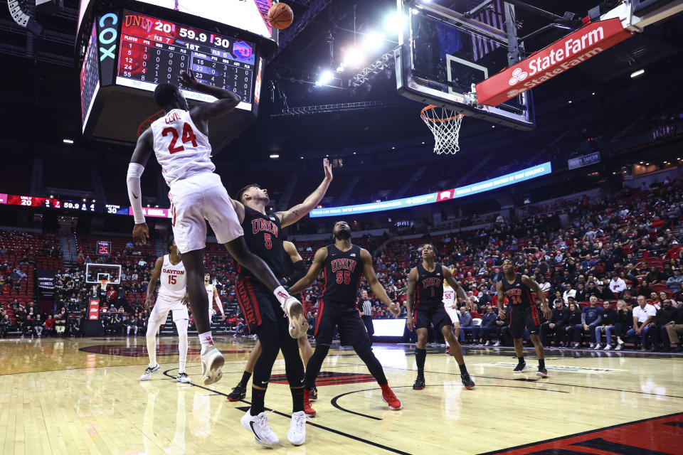 Dayton guard Kobe Elvis (24) lays up the ball over UNLV guard Jordan McCabe (5) during the first half of an NCAA college basketball game Tuesday, Nov. 15, 2022, in Las Vegas. (AP Photo/Chase Stevens)