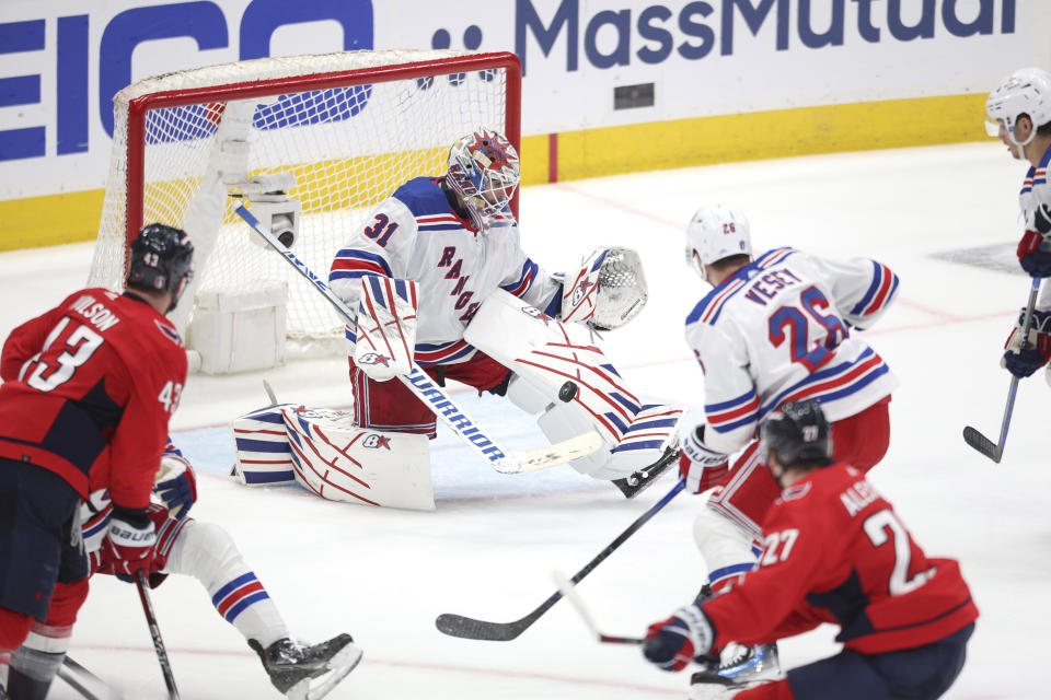 New York Rangers goaltender Igor Shesterkin (31) makes a save during the third period in Game 4 of an NHL hockey Stanley Cup first-round playoff series against the Washington Capitals Sunday, April 28, 2024, in Washington. (AP Photo/Tom Brenner)