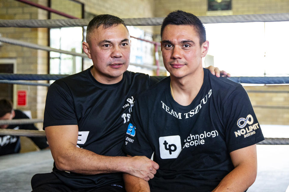 Kostya Tszyu hugs his son Tim Tszyu.