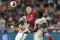 Real Salt Lake defender Justen Glad (15) works between Portland Timbers' Santiago Moreno (30) and Franck Boli (7) during the first half of an MLS soccer match Wednesday, May 17, 2023, in Sandy, Utah. (AP Photo/Rick Bowmer)