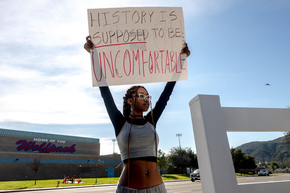 Student Samaya Robinson, 17, holds a sign in protest of the districts ban of critical race theory curriculum at Great Oak High School in Temecula on Friday, Dec. 16, 2022. / Credit: Watchara Phomicinda/The Press-Enterprise via Getty Images