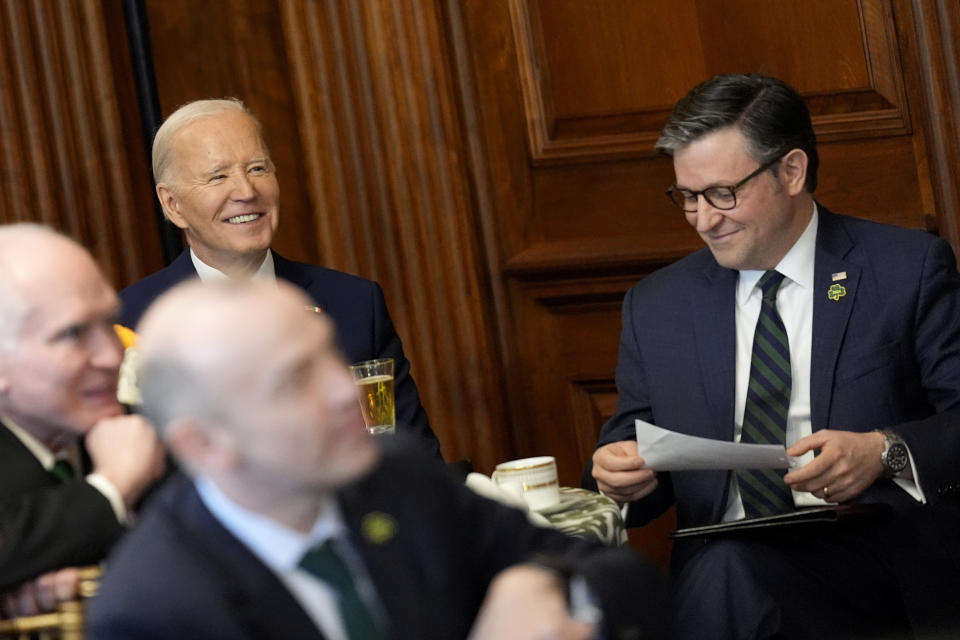 President Joe Biden, from left, and House Speaker Mike Johnson, R-La., listen as Ireland's Prime Minister Leo Varadkar, not pictured, speaks at a Friends of Ireland luncheon on Capitol Hill, Friday, March 15, 2024, in Washington. (AP Photo/Andrew Harnik)