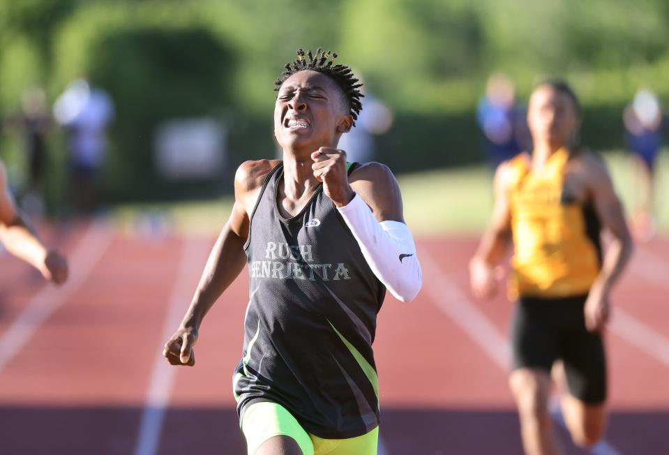 Rush-Henrietta's OJ Singletary pushes to the finish line to win the outdoor Section V Class A1 400 meter dash with a time of 49.34.