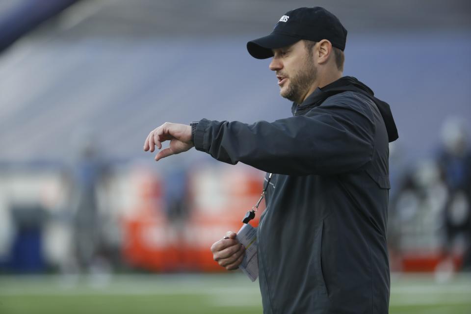 During Memphis Football’s "Friday Night Stripes” game head coach Ryan Silverfield reads his plays during a timeout at the Simmons Bank Liberty Stadium on April 21, 2023.