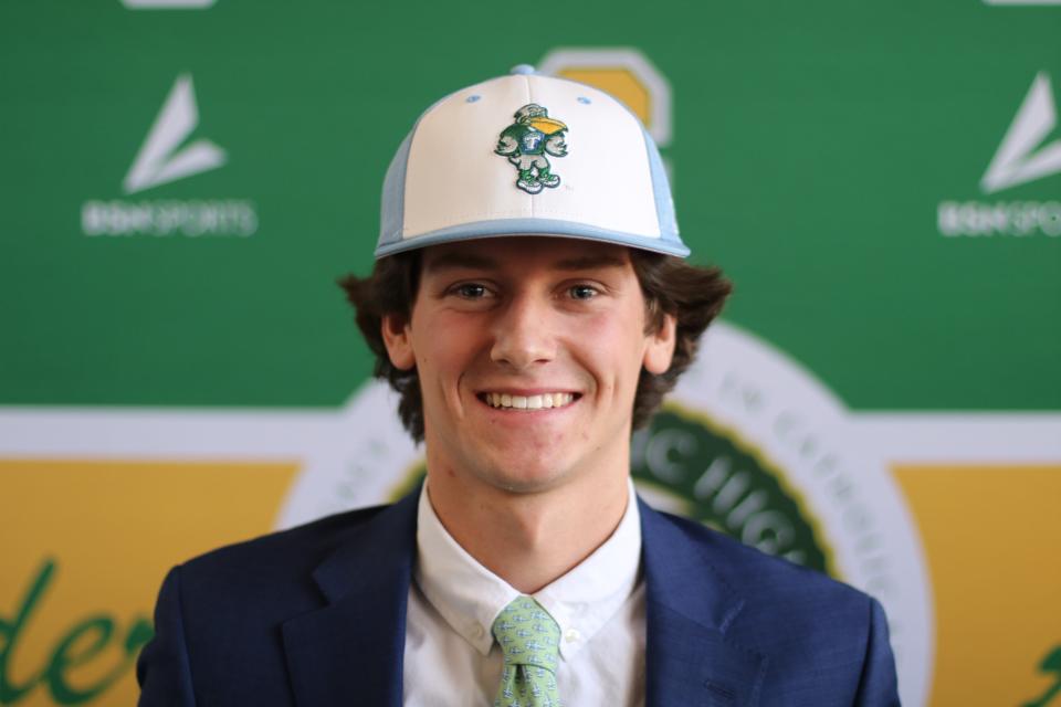Pensacola Catholic catcher Will Barter (bottom row center) poses for a photo after signing his letter of intent to baseball at Tulane University during a ceremony on Wednesday, Nov. 9, 2022 from Pensacola Catholic High School.