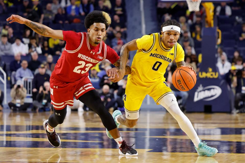 Michigan Wolverines guard Dug McDaniel drives on Wisconsin Badgers guard Chucky Hepburn in the first half at Crisler Center on Wednesday, Feb. 7, 2024, in Ann Arbor, Michigan.