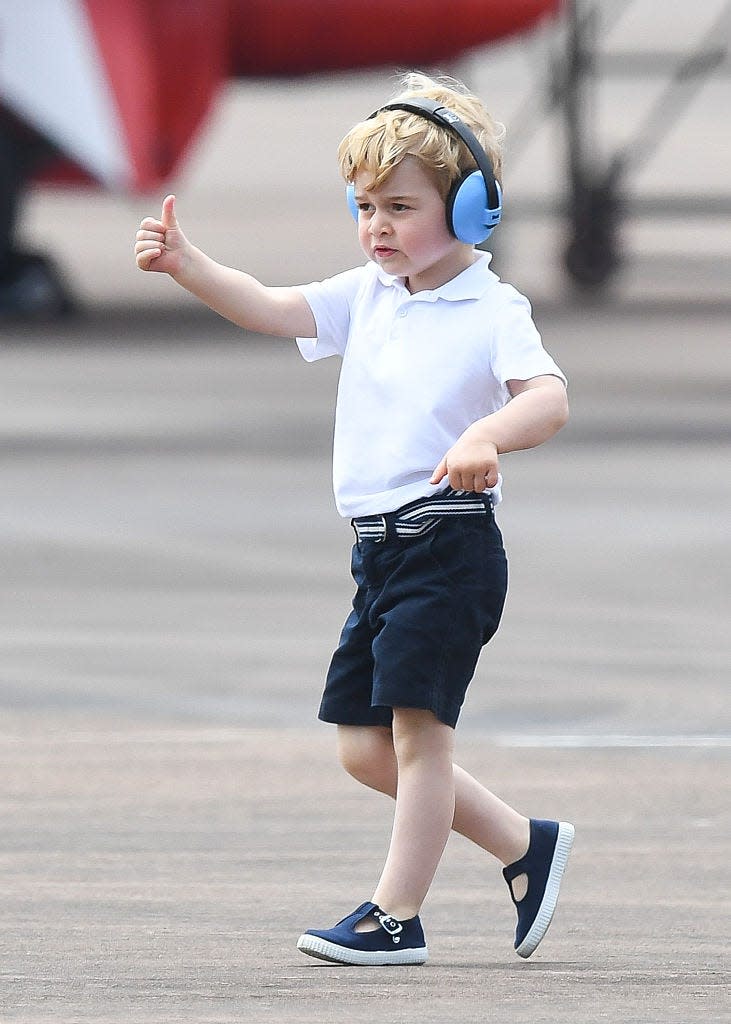 <p>George gave a thumbs up as he got to look at more aircrafts during a visit to The Royal International Air Tattoo at RAF Fairford in July 2016. </p>