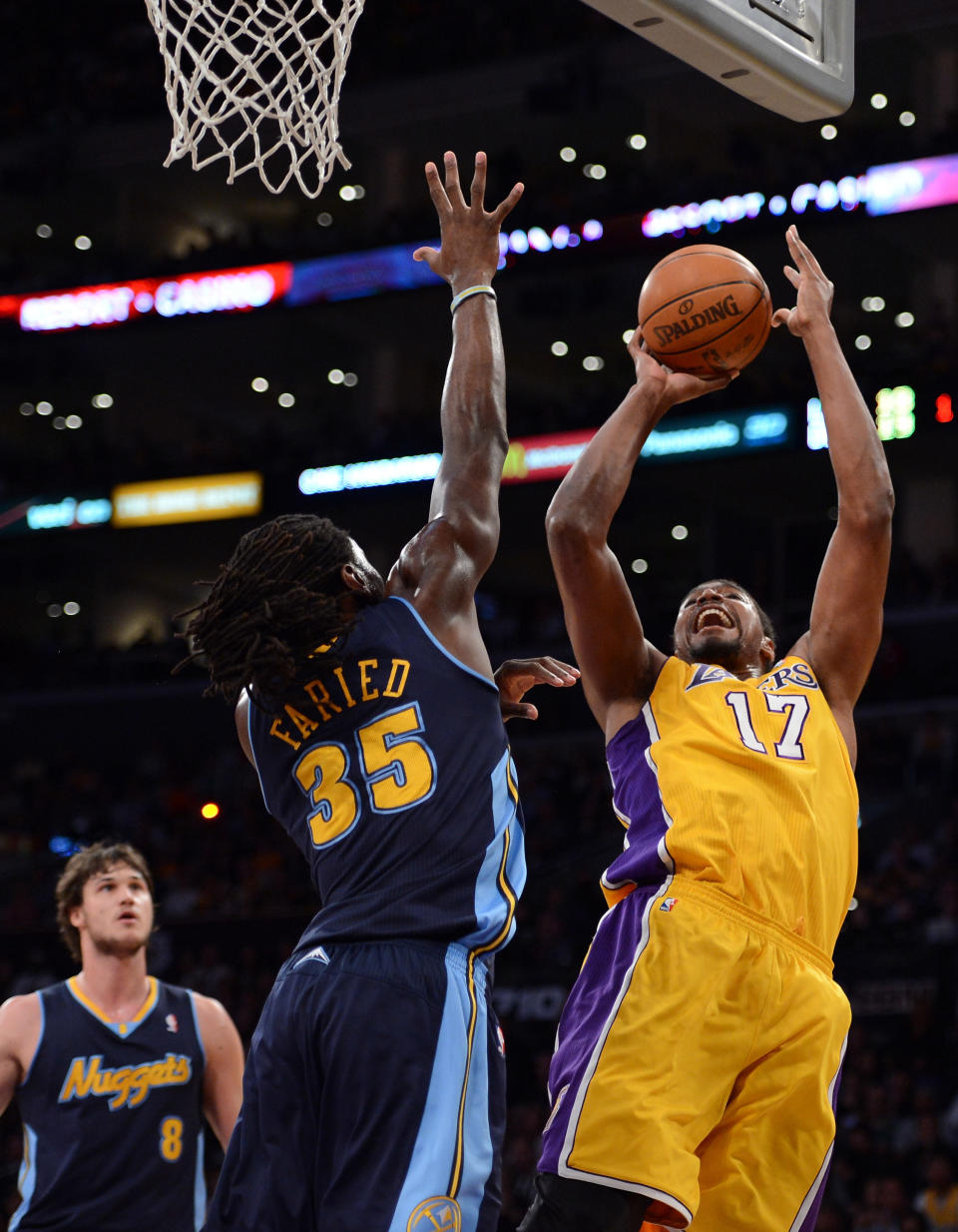 LOS ANGELES, CA - MAY 12: Andrew Bynum #17 of the Los Angeles Lakers shoots over Kenneth Faried #35 of the Denver Nuggets in the first quarter in Game Seven of the Western Conference Quarterfinals in the 2012 NBA Playoffs on May 12, 2012 at Staples Center in Los Angeles, California. NOTE TO USER: User expressly acknowledges and agrees that, by downloading and or using this photograph, User is consenting to the terms and conditions of the Getty Images License Agreement. (Photo by Harry How/Getty Images)