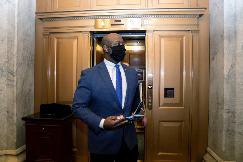 FILE - In this Feb. 13, 2021, file photo, Sen. Tim Scott, R-S.C., departs Capitol Hill in Washington. Scott will deliver Republicans’ rebuttal to President Joe Biden’s joint address to Congress. (Stefani Reynolds/Pool via AP, File)