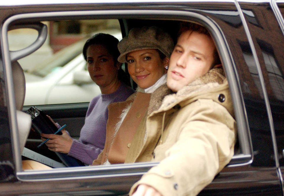 The couple in the backseat of a car