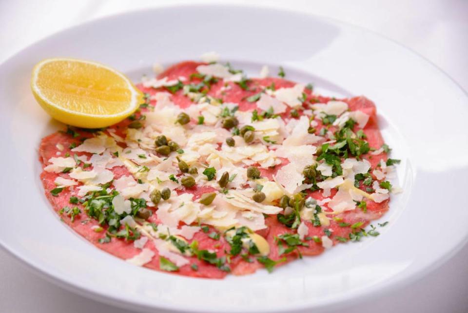 Carpaccio, raw tenderloin beef sliced paper thin and served with capers, light mustard, arugula and Parmesan, is a favorite appetizer at Café Roma in San Luis Obispo.