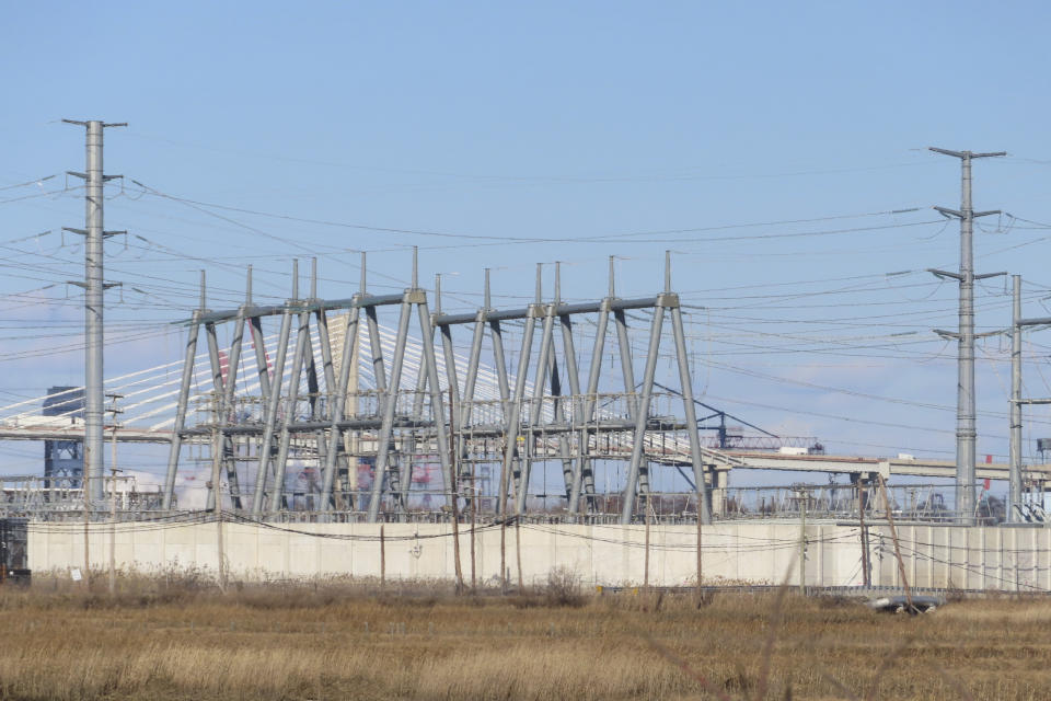 A gas-fired power plant in Linden, N.J., is seen on Feb. 29, 2024. On March 4, 2024, New Jersey lawmakers watered down a proposed referendum on whether to ban construction of new power plants that burn fossil fuels, adding a loophole that allowed for construction of new emergency backup plants that burn fossil fuels. (AP Photo/Wayne Parry)