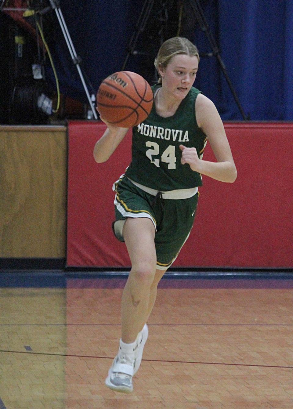 Monrovia junior Ashley Lewis takes the ball down the court during Wednesday's Powder Keg game at Eminence. 