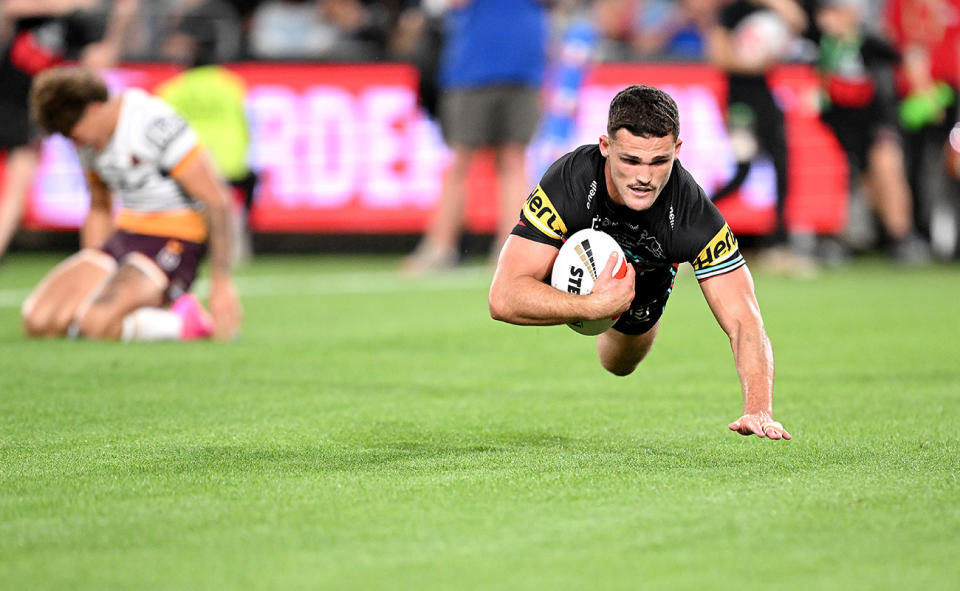 Nathan Cleary, pictured here after running past Reece Walsh to score the match-winning try in the NRL grand final.