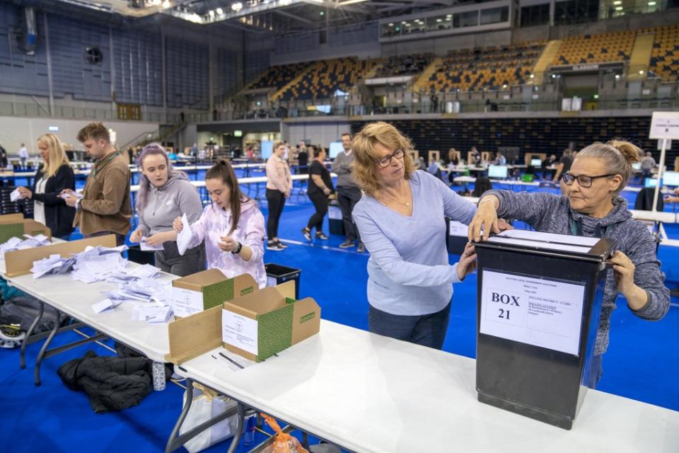 Ballot boxes are opened ready for sorting at the Glasgow City Council count at the Emirates Arena (Jane Barlow/PA) (PA Wire)