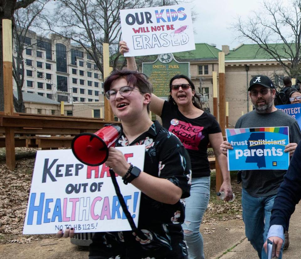 Leviathan Myers-Rowell, 16, from left, of Ocean Springs, Miss., and his parents Jodi and Thomas Rowell march from the state Capitol toward the governor’s mansion following a rally at the Capitol in support of transgender youth and in opposition to House Bill 1125 in Jackson, Miss., Wednesday, Feb. 15, 2022. HB 1125 prohibits transgender-related healthcare in Mississippi for people under the age of 18. (Barbara Gauntt//The Clarion-Ledger via AP)