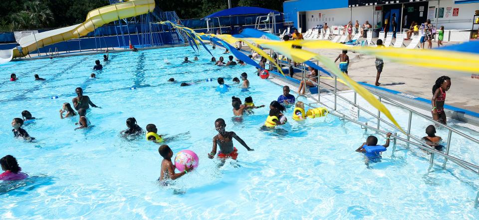 Kids play in Northeast Pool during the summer kick-off pool party for the Heatwave program in Gainesville Friday June1, 2018.   The pool will be the site of two Summer Heatwave free pool parties this summer.