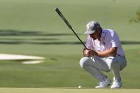 Bryson DeChambeau lines up a putt on the 10th hole during third round at the Masters golf tournament at Augusta National Golf Club Saturday, April 13, 2024, in Augusta, Ga. (AP Photo/George Walker IV)