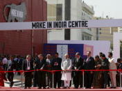 Sweden's Prime Minister Stefan Lofven (L), PM Narendra Modi (C) and Finland's Prime Minister Juha Sipila (R) cut a ribbon during the inauguration for the exhibition centre of the 'Make In India' week in Mumbai, February 13, 2016. REUTERS/Danish Siddiqui