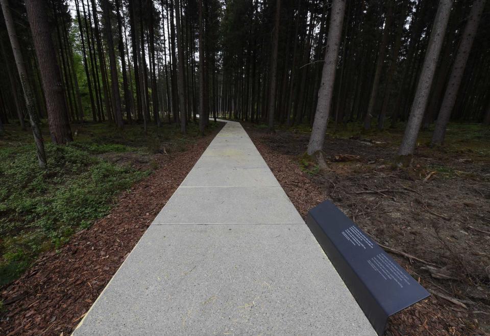 Concrete slabs lead to the places of the former mass grave of the former concentration camp Muehldorf at the Muehldorfer Hart, southern Germany, pictured on April 26, 2018. | AFP via Getty Images