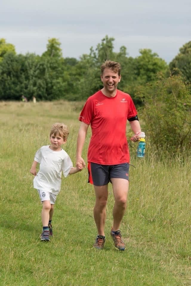 Wes Ball runs with his son William at a weekly Parkrun event in Buckinghamshire. (Wes Ball/PA)