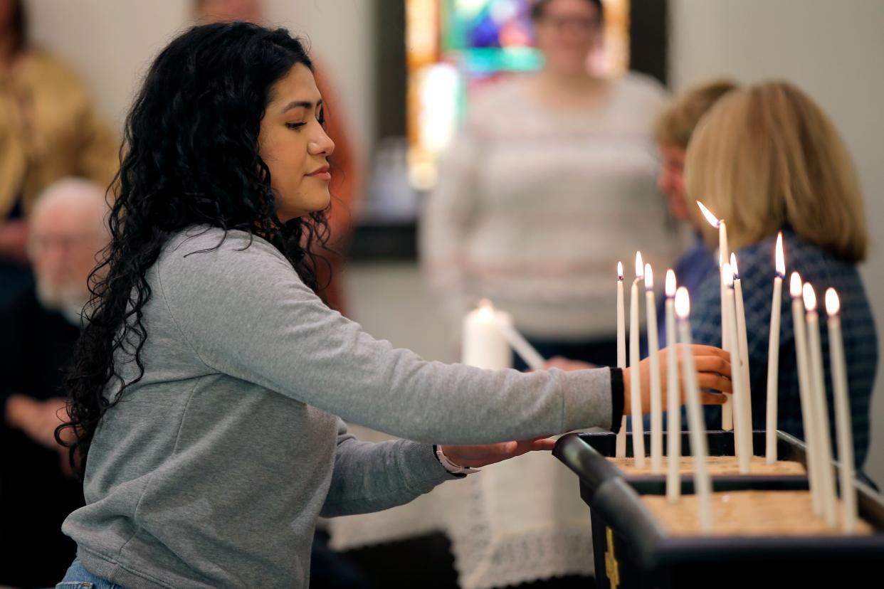 Mariah Huston prepares to light a candle on the altar at Eighth Street Church of the Nazarene during the Homeless Persons Memorial Service on Saturday in Oklahoma City.
(Photo: BRYAN TERRY/THE OKLAHOMAN)