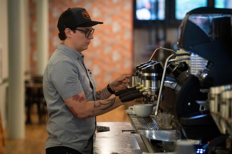 Ryan Bledsoe, the head of coffee education for Frothy Monkey, brews a latte at the business's new downtown Knoxville location at 419 S. Gay St. The Nashville-based business recently opened its first out-of-state location in Birmingham, Alabama, and has four locations in the Music City, one in Chattanooga and another in Franklin.