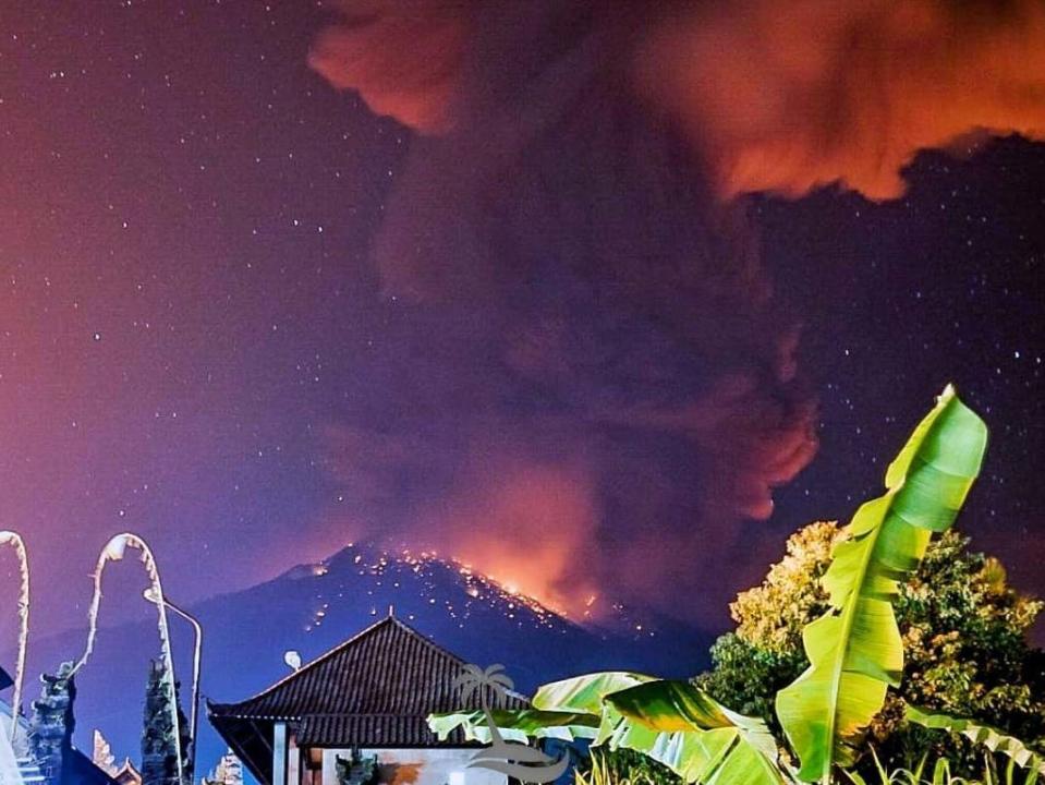 A volcano has erupted on the Indonesian holiday island of Bali, causing flight cancellations to and from Australia after a huge ash cloud rose into the sky.The Mount Agung volcano spewed out lava and showers of rocks over a distance of about two miles late on Friday night, with ash falling over dozens of villages, according to officials on the island.There were no reports of casualties, but the national disaster agency imposed a 2.5 mile exclusion zone around the mountain and said 50,000 masks would be available as a precaution.Bali airport spokesman Arie Ahsanurrohim said nine flights between Bali and Australia were cancelled on Friday night, flights to and from New Zealand have not been affected.Brent Thomas, commercial director at New Zealand travel company House of Travel, said tourists should be operating on a “watch and see” basis. “It could go dormant again or it could erupt again, no one knows,” he told the New Zealand Herald.Six postponed flights for Qantas and Virgin Australia were set to go ahead on Saturday, said Mr Ahsanurrohim, as the island’s airport returned to normal operations.A spokesperson for Auckland Airport said New Zealand flights were also expected to go ahead today. “There are no disrupted flights that we are aware of, but this may change.”Photographs taken near Agung showed an ash column and glowing lava in the crater of the volcano, which rises over eastern Bali at a height of just over 3,000 metres.> May 24, 2019 ~ Mount Agung Eruption from VolcanoYT. agung volcano eruption bali indonesia > VolcanoYT:https://t.co/ZPhT8MEx2A > This clip is taken from a new camera owned and operated by VolcanoYT. pic.twitter.com/ggDvIVkAhd> > — Volcano Time-Lapse (@DavidHe11952876) > > 24 May 2019In late 2017, authorities raised the alert level on Agung after a spike in activity, triggering evacuations and travel chaos at the time.The alert level has since been lowered but the rumbling Agung has erupted intermittently since then and occasionally disrupted flights.A major eruption in 1963 killed more than 1,000 people and razed several villages. Agung is only one more than 120 active volcanoes in Indonesia, which is prone to eruptions and earthquakes due to its location on the “Ring of Fire” – a series of fault lines stretching from the western hemisphere to Japan and southeast Asia.Famous for its surf, beaches and temples, Bali attracts around 5 million visitors a year.Additional reporting by agencies
