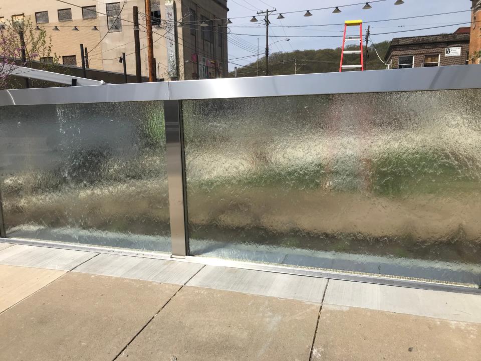 A waterfall effect grabs attention for people walking past Library Park, at 13th Street and Seventh Avenue, in Beaver Falls. It's part of the Beaver Falls Core, an area of innovation and entertainment.