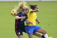 United States midfielder Lindsey Horan (9) and Brazil midfielder Andressa (7) compete for a header during the first half of a SheBelieves Cup women's soccer match, Sunday, Feb. 21, 2021, in Orlando, Fla. (AP Photo/Phelan M. Ebenhack)