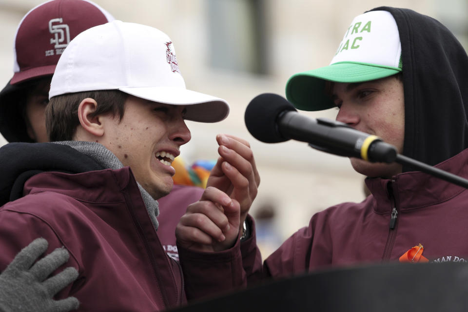 <p>Joseph Zenobi, left, a student from Marjory Stoneman Douglas in Parkland, Fla. broke down crying as he spoke about his friends who were killed during a rally against gun violence Saturday at the State Capitol in St. Paul, Minn., as part of the national March for Our Lives event. (Anthony Souffle/Star Tribune via AP) </p>