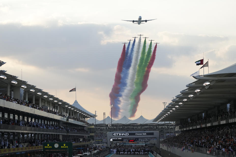 Aircraft fly over the track bbefore the Formula One Abu Dhabi Grand Prix in Abu Dhabi, United Arab Emirates, Sunday, Dec. 12. 2021. (AP Photo/Hassan Ammar)