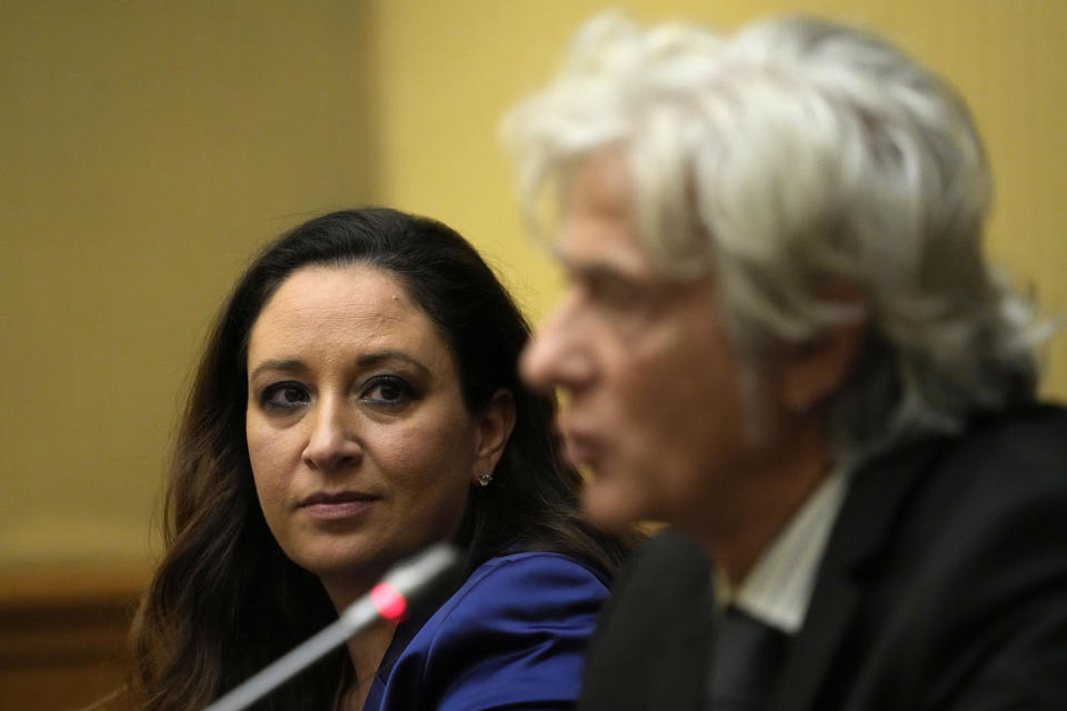 Lawyer Laura Sgro, left, listens to his client Pietro Orlandi, brother of Manuela, a 15-year-old daughter of a Vatican employee disappeared in 1983, during a press conference on the establishing of a parliamentary investigative commission on Manuela Orlandi and other cold cases in Rome, Tuesday, Dec. 20, 2022. (AP Photo/Alessandra Tarantino)