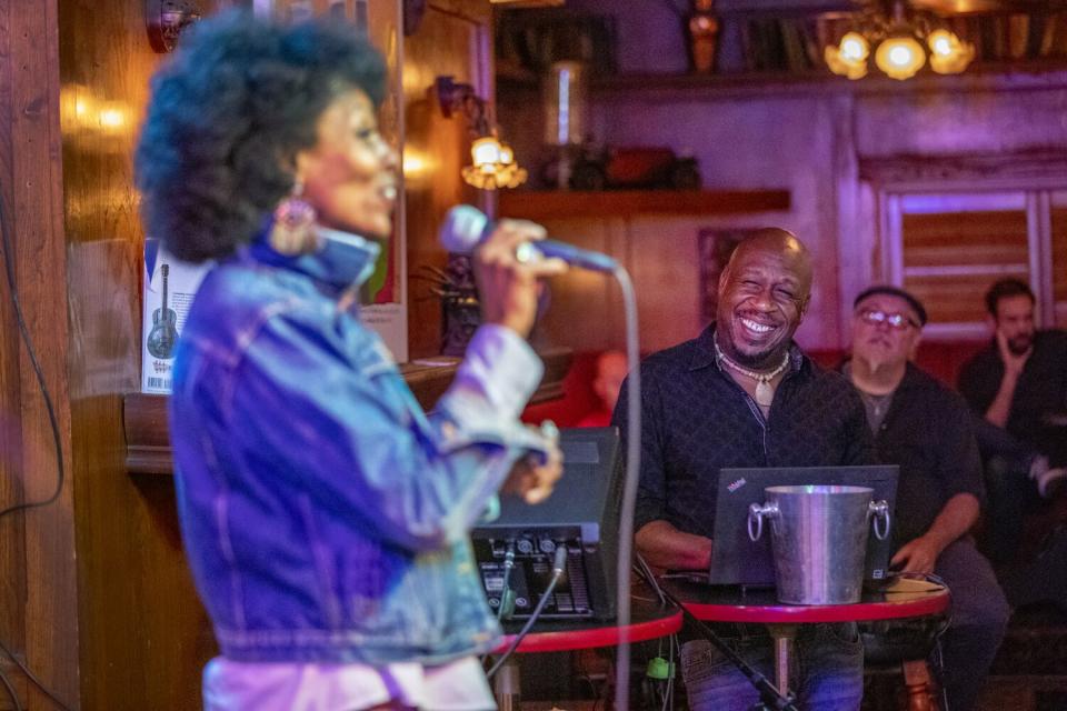 Jerome Anderson, center, laughs at a joke as "V" performs her comedic act at the Maui Sugar Mill Saloon in Tarzana