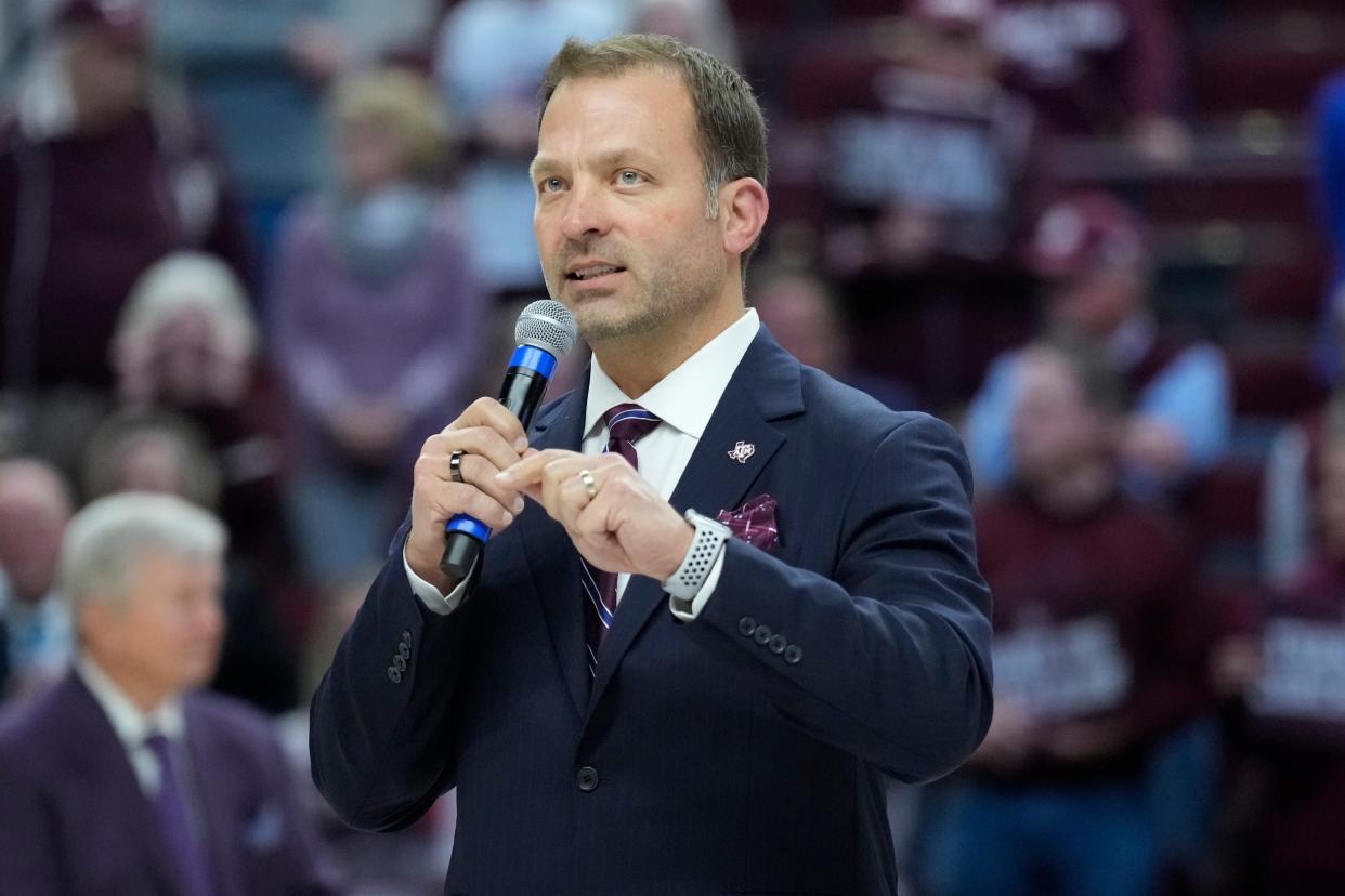 Texas A&M athletic director Ross Bjork speaks to the crowd at Reed Arena during a ceremony for Texas A&M head coach Gary Blair after an NCAA college basketball game Thursday, Feb. 24, 2022, in College Station, Texas. Blair has announced that he will be retiring at the end of the 2021-2022 season. (AP Photo/Sam Craft)