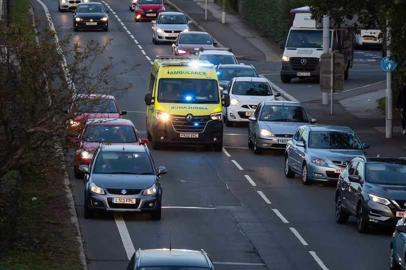 An ambulance rushing to an emergency in a London road