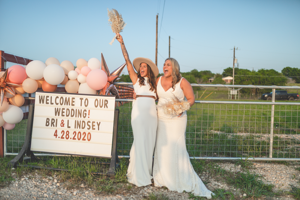 Bri and Lindsey Leaverton had a drive-in wedding after the coronavirus pandemic thwarted their originals plans. (Photo: Greg Fulks)