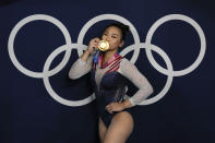Sunisa Lee, of United States, reacts as she poses for a picture after winning the gold medal in the artistic gymnastics women's all-around final at the 2020 Summer Olympics, Thursday, July 29, 2021, in Tokyo, Japan. (AP Photo/Gregory Bull)
