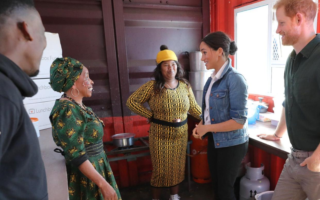 Meghan and Prince Harry visit the Waves for Change compound kitchen, where charity The Lunchbox Fund, provides 30,000 meals daily at Monwabisi Beach in Cape Town, on Sept 24, 2019