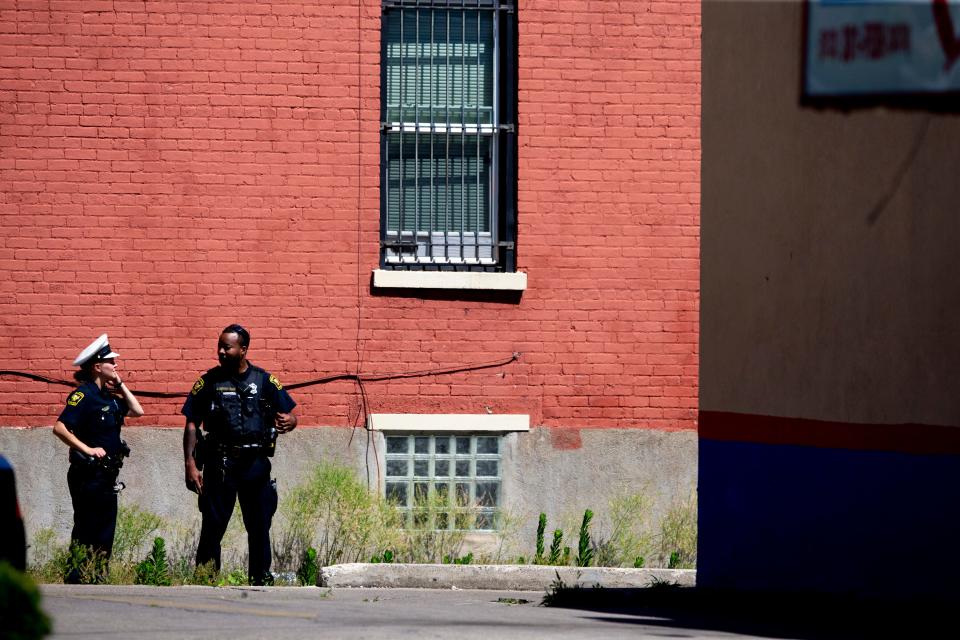 Cincinnati Police investigate a fatal shooting behind the Hook Fish & Chicken restaurant in West End on Thursday, June 30, 2022. 