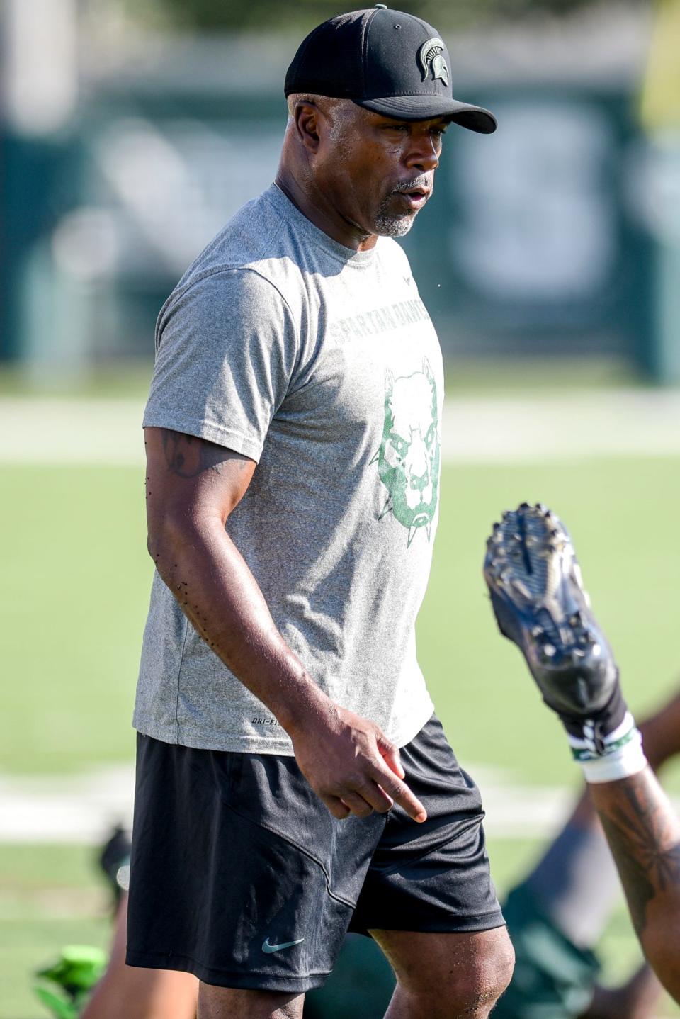 Michigan State's wide receivers coach Courtney Hawkins looks on during the opening day of MSU's football fall camp on Thursday, Aug. 3, 2023, in East Lansing.