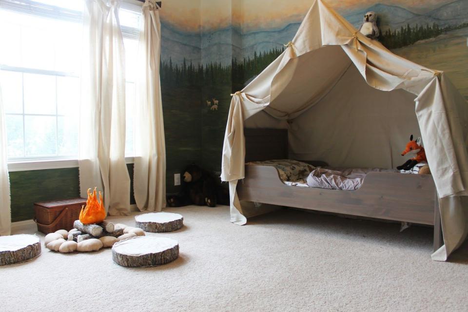 <p>Turn your kid's room into a campground by using canvas cloth to create a "tent." And let's be honest: With a bed like this, your kid will probably love being sent to their room. </p><p>Get the tutorial at <a rel="nofollow noopener" href="http://theraggedwren.blogspot.com/2013/10/how-to-camping-tent-bed.html" target="_blank" data-ylk="slk:The Ragged Wren;elm:context_link;itc:0;sec:content-canvas" class="link ">The Ragged Wren</a>. </p>