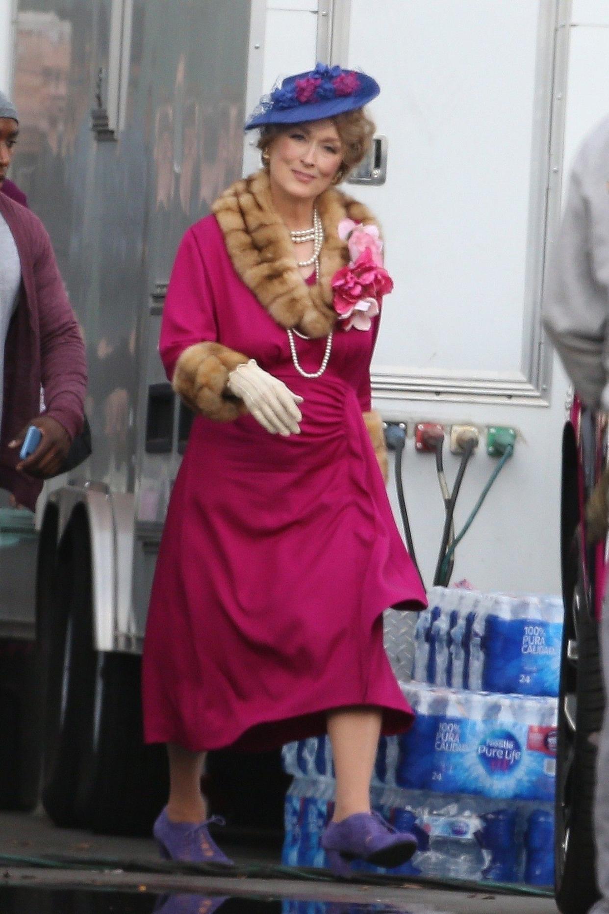 Meryl Streep is looking pretty in pink as Dee Dee Allen for the upcoming Netflix musical, "The Prom." The two actors looked prom-ready as James sports a blue suit and Meryl a pink dress while on the Downtown Los Angeles set on Dec. 10, 2019.