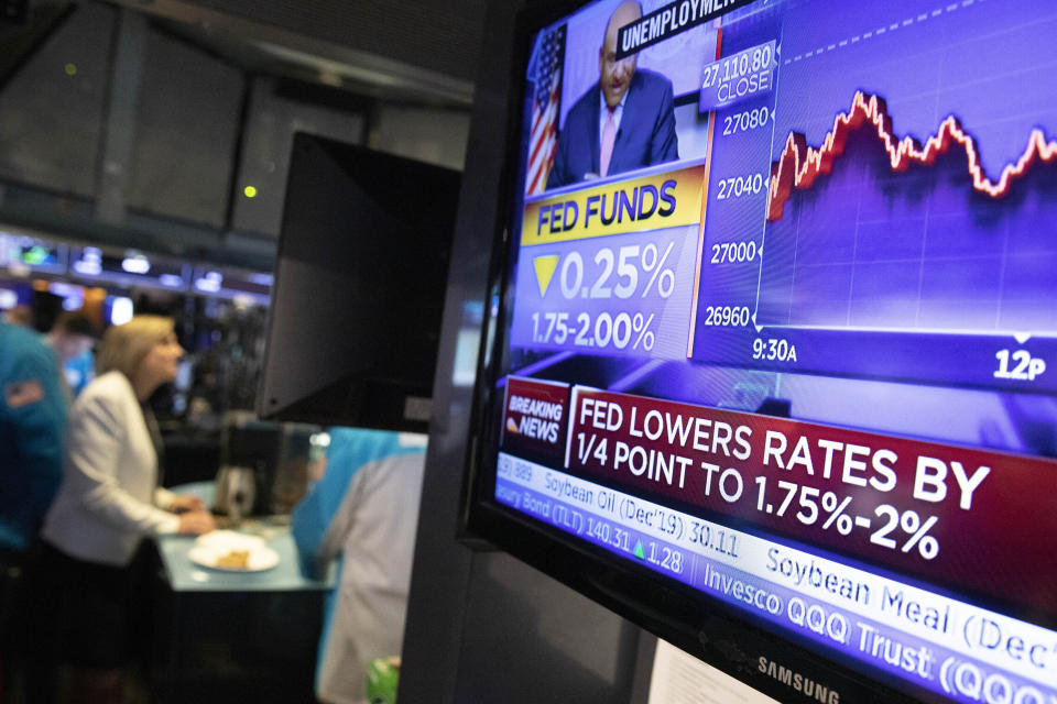 FILE - In this Sept. 18, 2019, file photo a television monitor at the New York Stock Exchange carries the news after the Federal Reserve made its interest rate announcement. The Federal Reserve finds itself in an unusually delicate spot as it considers how much more to try to stimulate an economy that’s still growing and adding jobs but also appears vulnerable. As it considers a potential interest rate cut at its meeting next week, a string of complicated questions is clouding the Fed’s outlook. (AP Photo/Mark Lennihan, File)