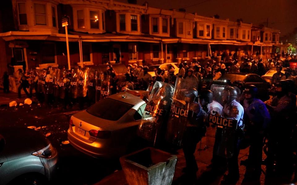 Police move in to disperse a protest in response to the police shooting of Walter Wallace Jr. - Jessica Griffin /The Philadelphia Inquirer 