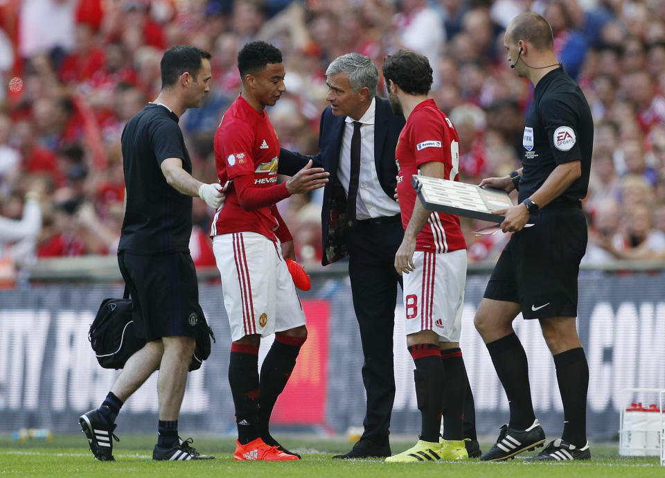 Football Soccer Britain - Leicester City v Manchester United - FA Community Shield - Wembley Stadium - 7/8/16 Manchester United's Jesse Lingard is substituted by Juan Mata as manager Jose Mourinho looks on Action Images via Reuters / John Sibley Livepic EDITORIAL USE ONLY. No use with unauthorized audio, video, data, fixture lists, club/league logos or "live" services. Online in-match use limited to 45 images, no video emulation. No use in betting, games or single club/league/player publications. Please contact your account representative for further details.