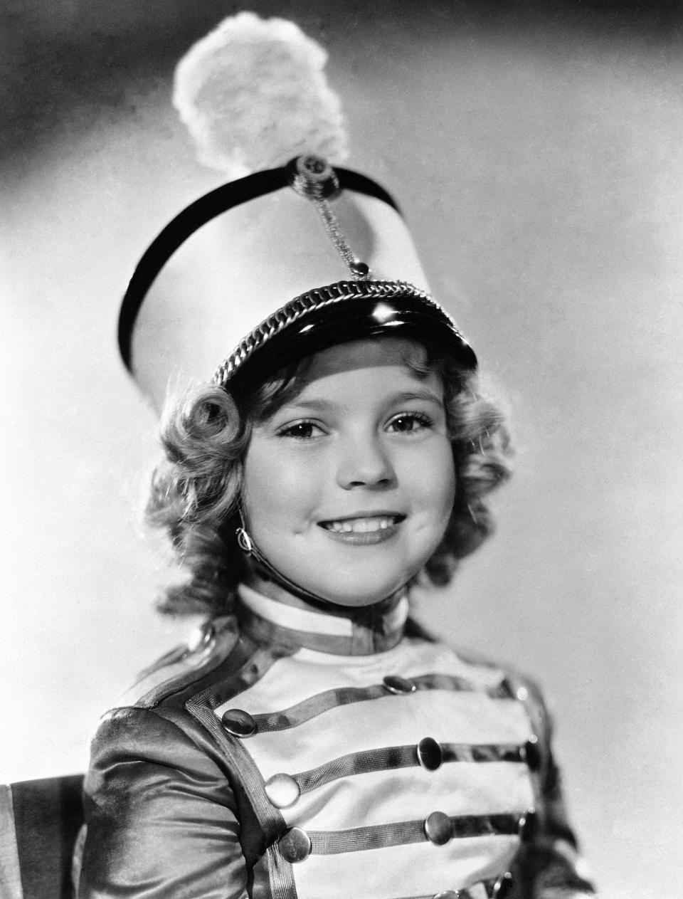 FILE - In this 1936 file photo, actress Shirley Temple is photographed as she appeared in Poor Little Rich Girl. Temple, who was born in 1928 and began acting at the age of three, received an honorary Academy Award in 1934 for her contributions as a child film star. Shirley Temple, the curly-haired child star who put smiles on the faces of Depression-era moviegoers, has died. She was 85. Publicist Cheryl Kagan says Temple, known in private life as Shirley Temple Black, died surrounded by family at her home near San Francisco. (AP Photo/File)