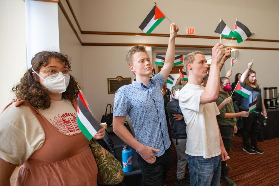 Florida State University Students for a Democratic Society and other organizations attend an FSU Board of Trustees meeting where they waived Palestinian flags and chanted before being escorted out by the FSU Police Department on Friday, Nov. 10, 2023.